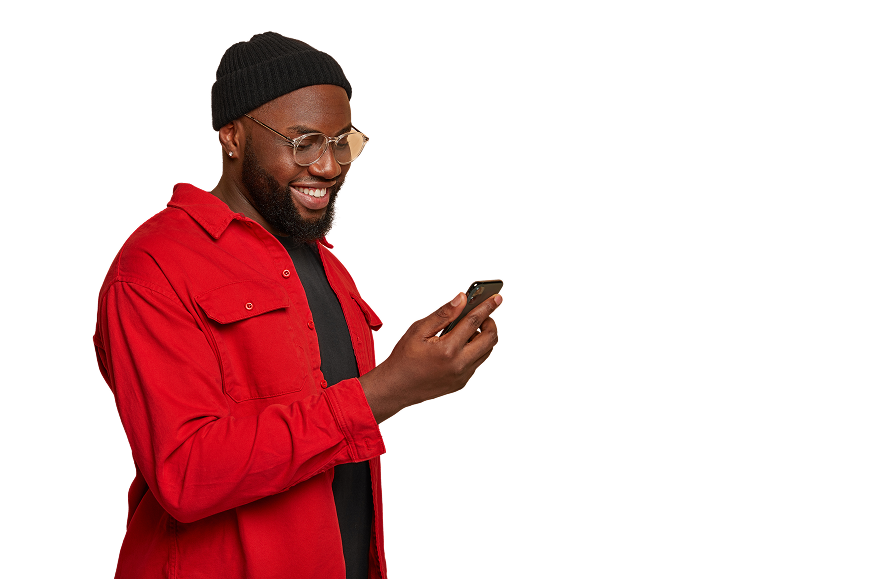 A man in a red shirt checking his phone